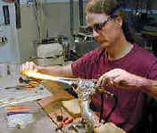 photo: Chuck Pound making glass icicles. (yes, the photo is me many years ago!)